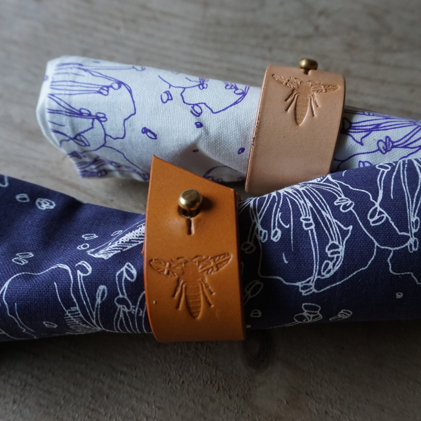 Set of 4 hand made leather napkin rings: Angled edge