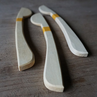 Hand carved sycamore spreader