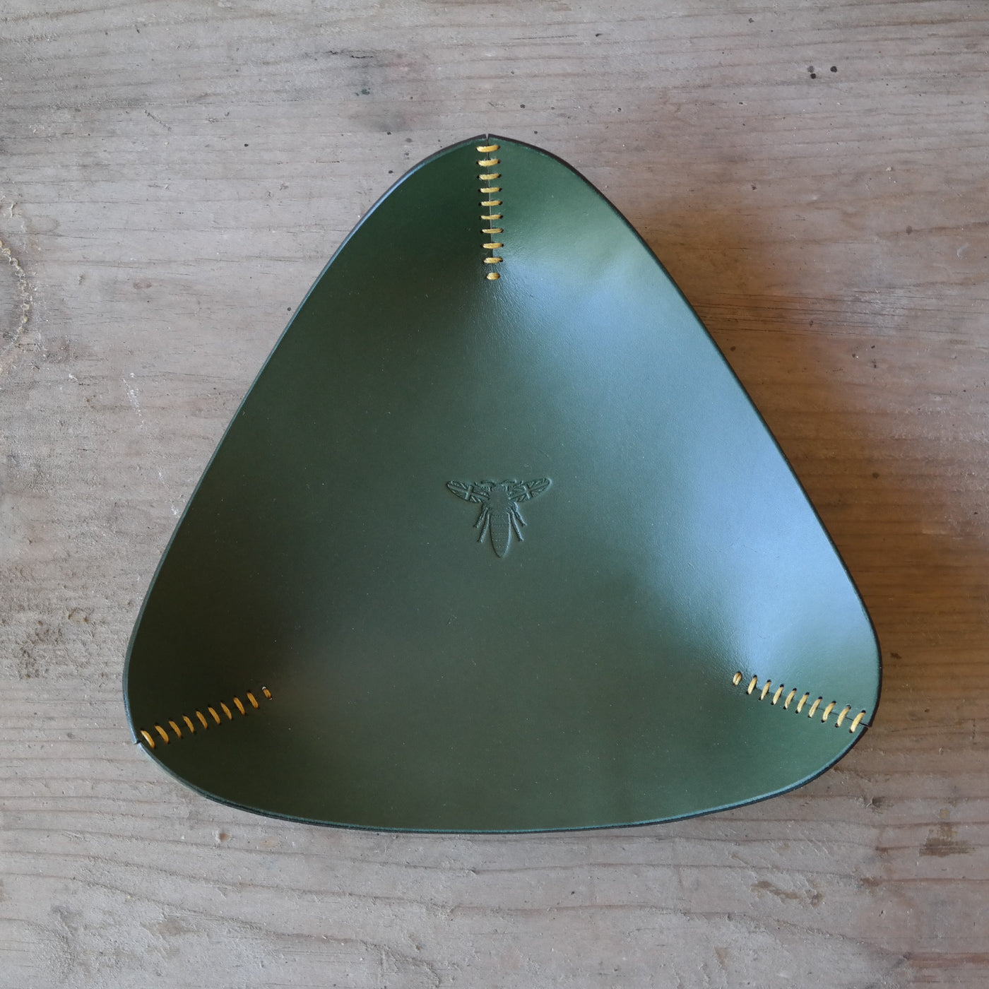 Triangle leather coin tray in dark green British leather
