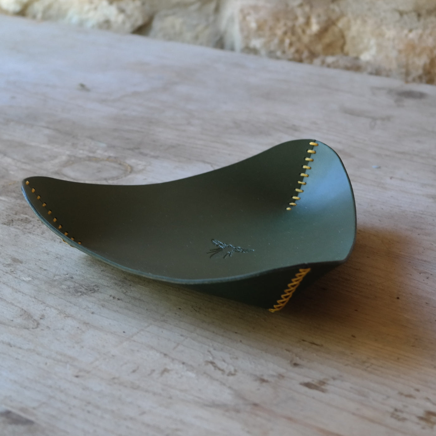 Triangle leather coin tray in dark green British leather