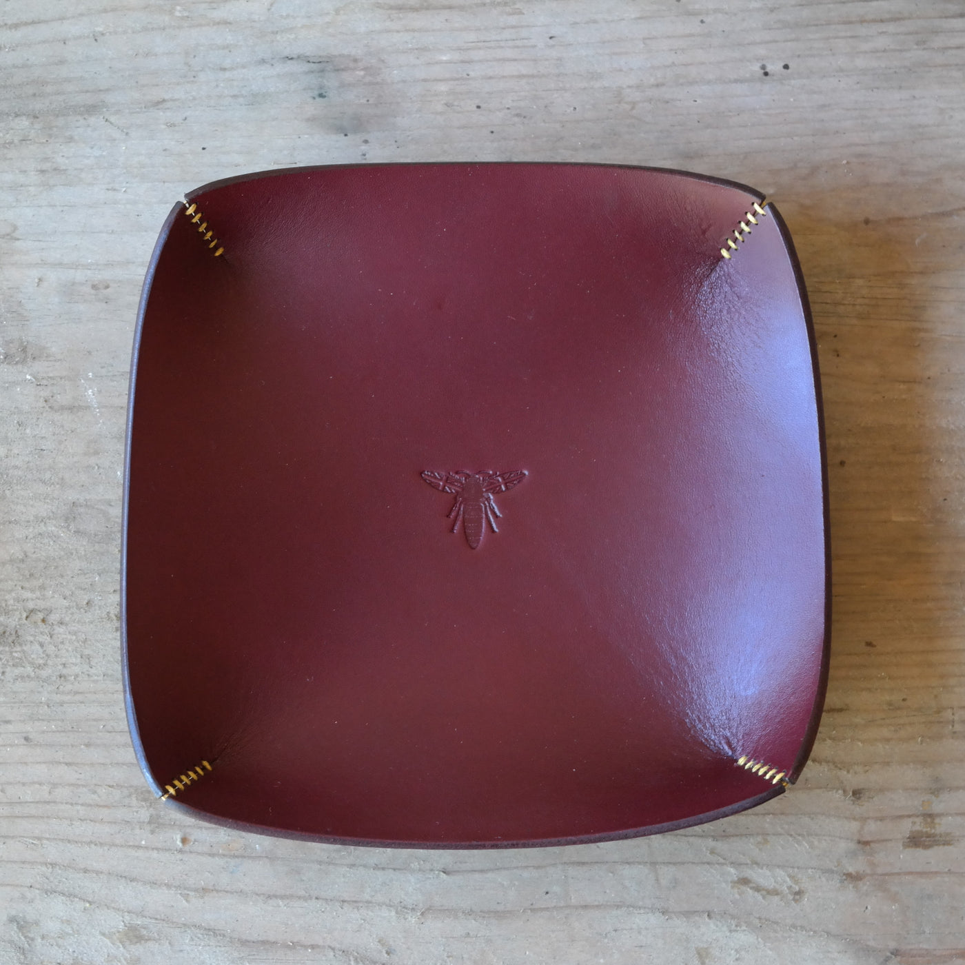 Square leather coin tray in deep plum British leather